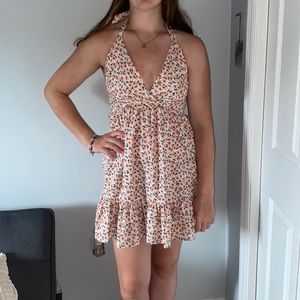 flowered mini sun dress with open back. brand new but no tags. never worn